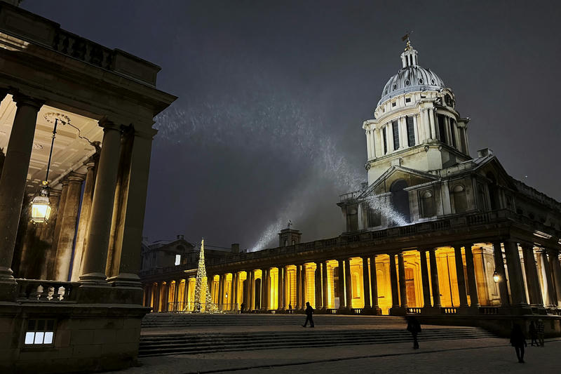 The Old Royal Naval College lit up at night in the snow