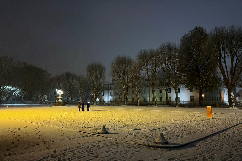 A square in the Old Royal Naval College, Greenwich, at night in the snow