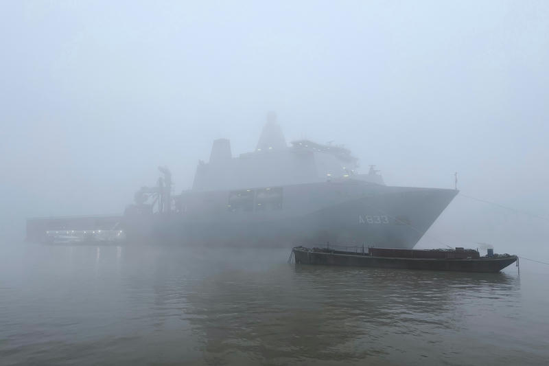 A Dutch Royal Naval vessel, the HNLMS Karel Doorman, moored on the Thames at Greewnwich, in the fog
